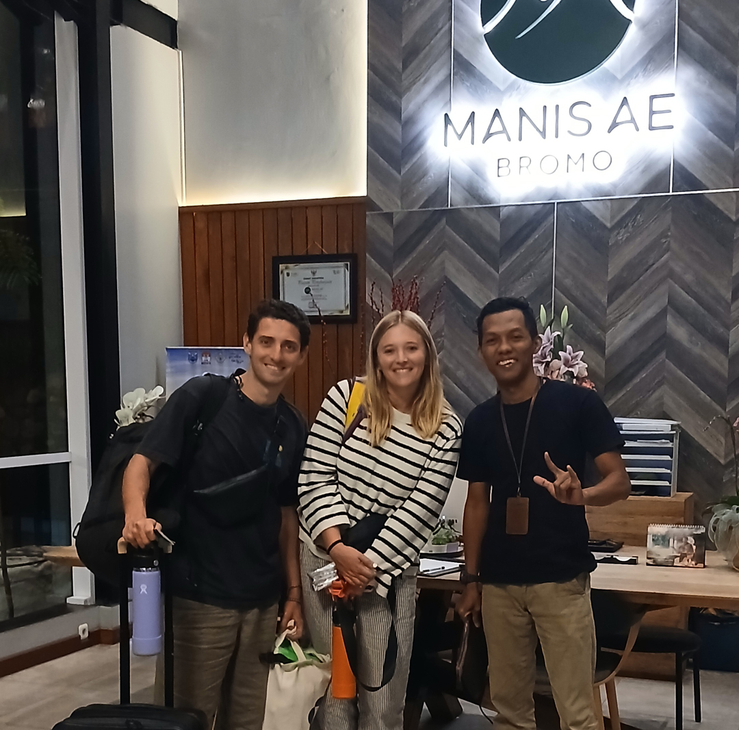 Scenic view of Kawah Ijen volcano at sunset with colorful sky and crater lake